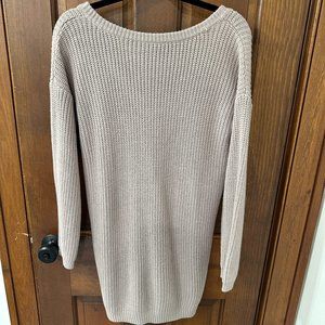 Blush colored long sleeve sweater dress with v-neck back.